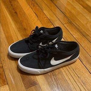 Nike Black Low-Top Sneakers with White Swoosh